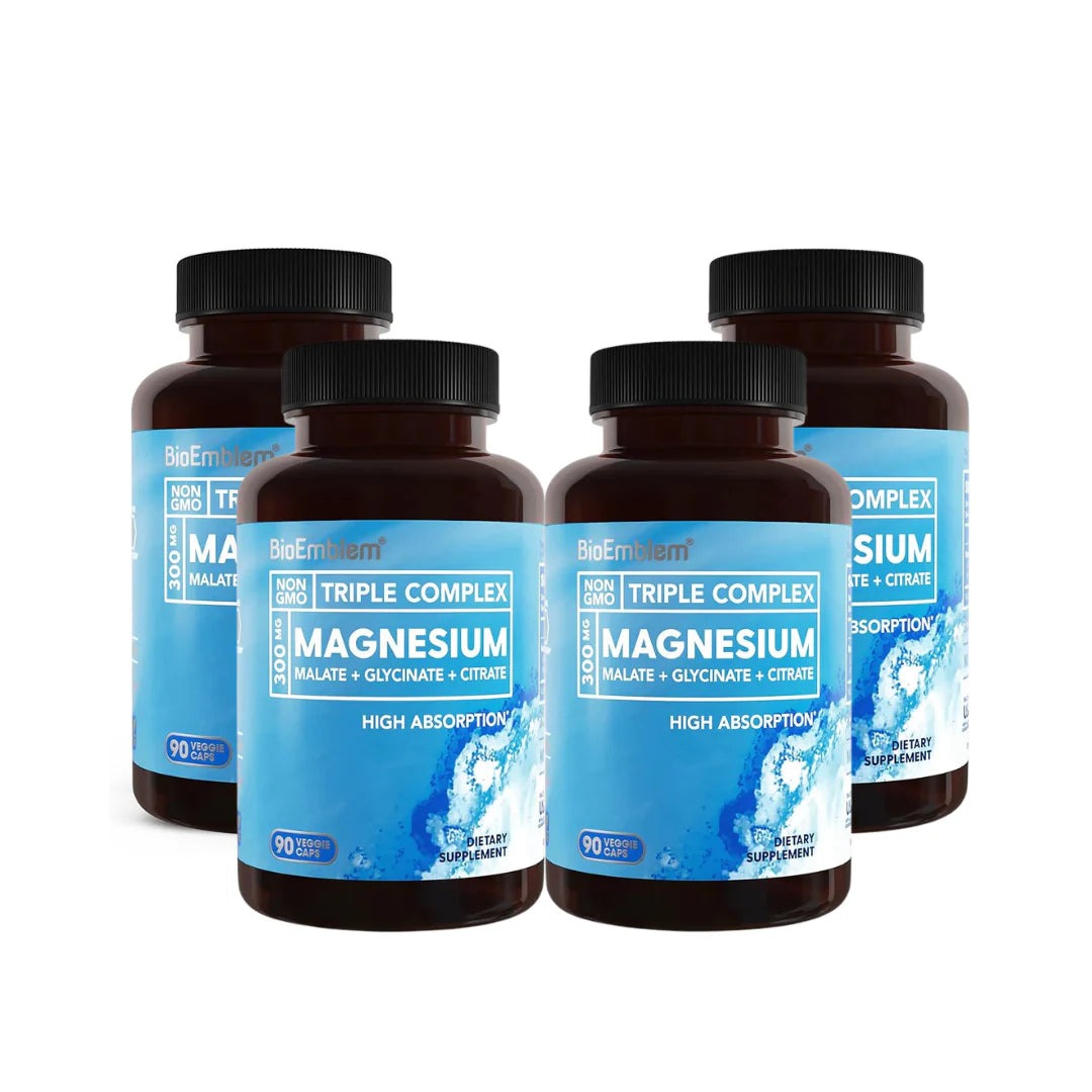 Four bottles of magnesium supplement with blue and brown labels on a white background