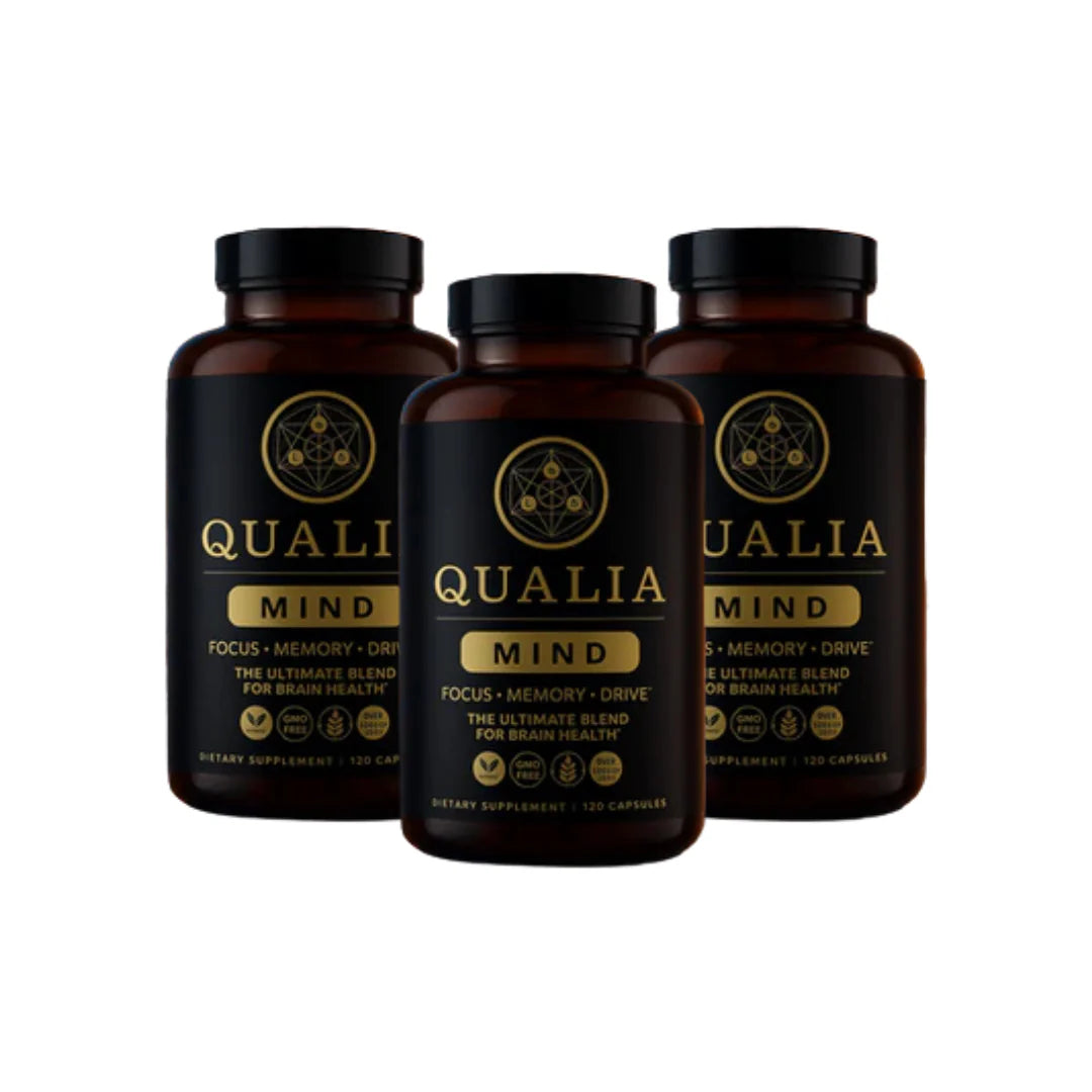 Three bottles of Qualia Mind supplements on a white background