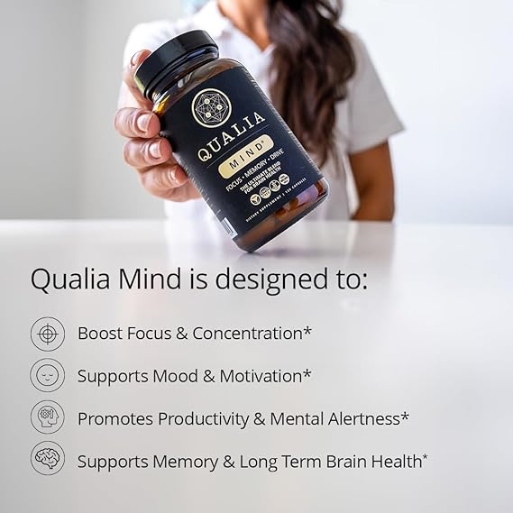 Person holding a bottle of Qualia Mind supplement with product features listed below.