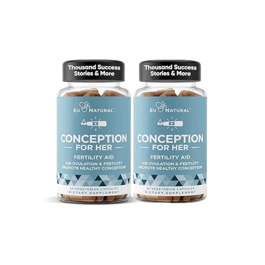 Two bottles of 'Conception for Her' fertility aid supplement on a white background