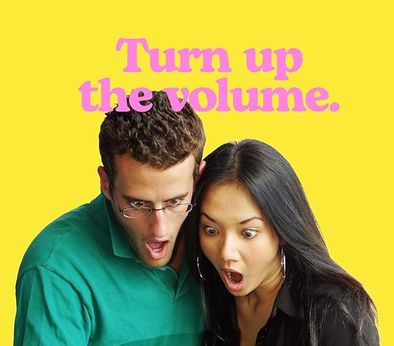 Two people with a yellow background and text 'Turn up the volume.'