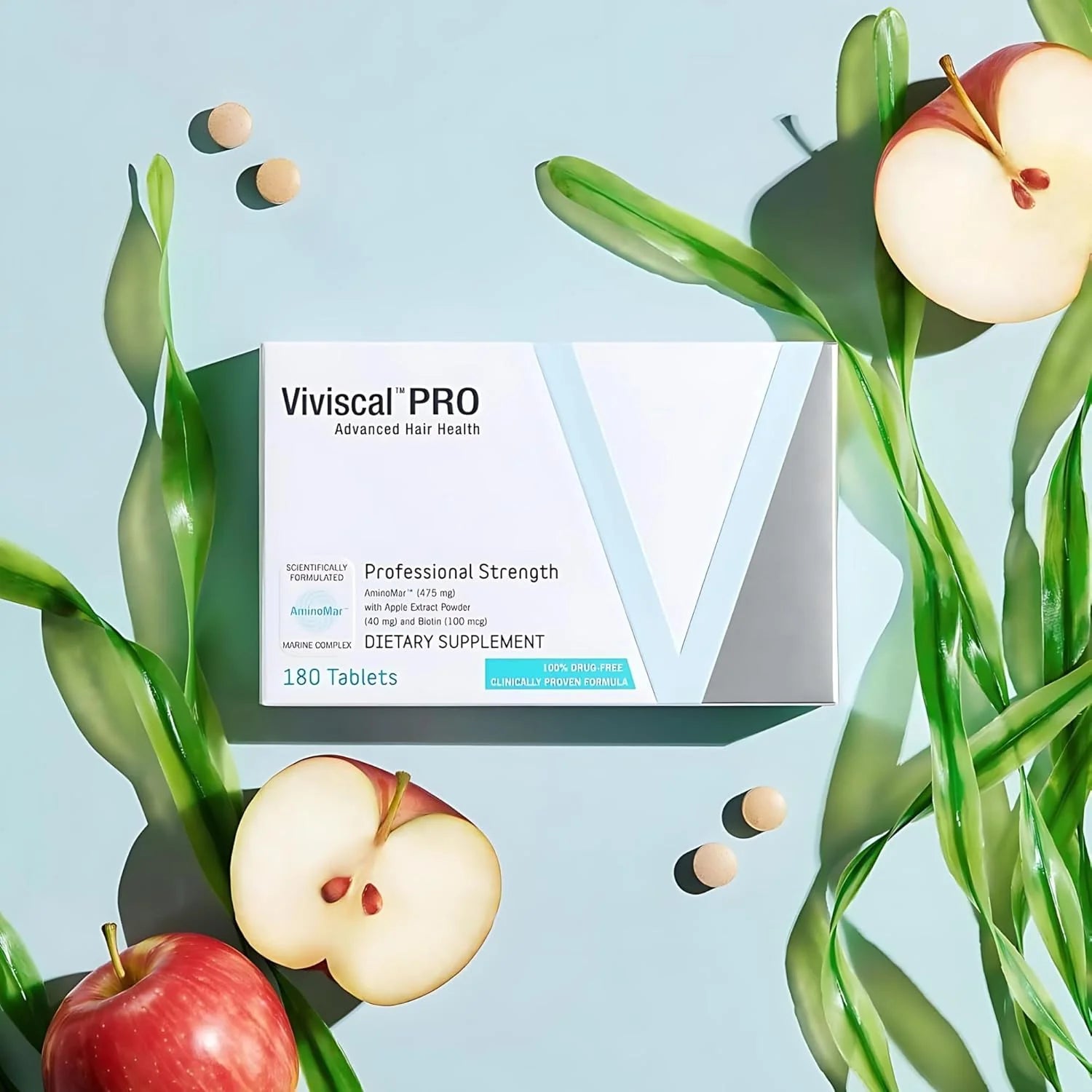 Viviscal Pro supplement box with apples and green leaves on a light blue background