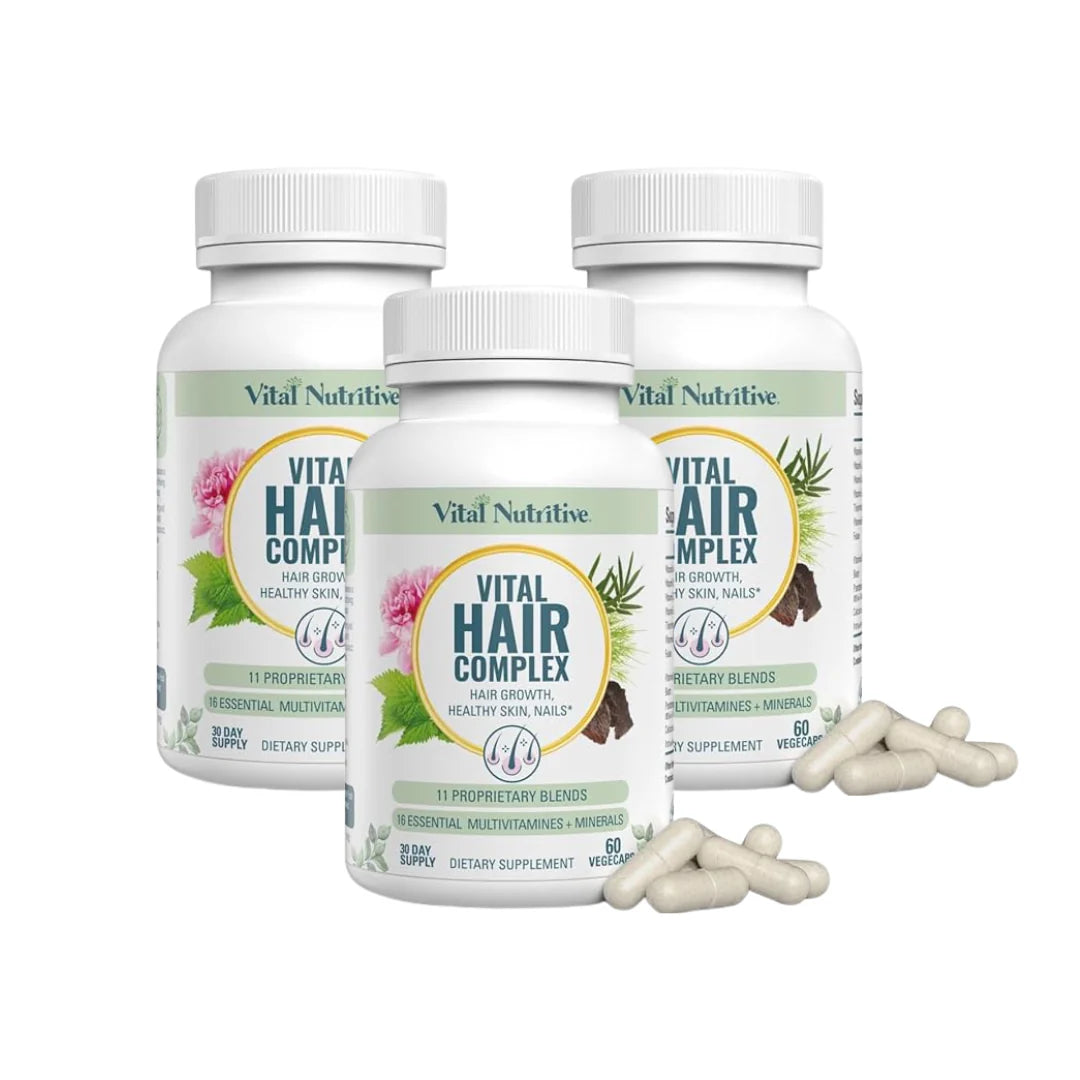 Three bottles of Vital Nutritive Hair Complex on a white background
