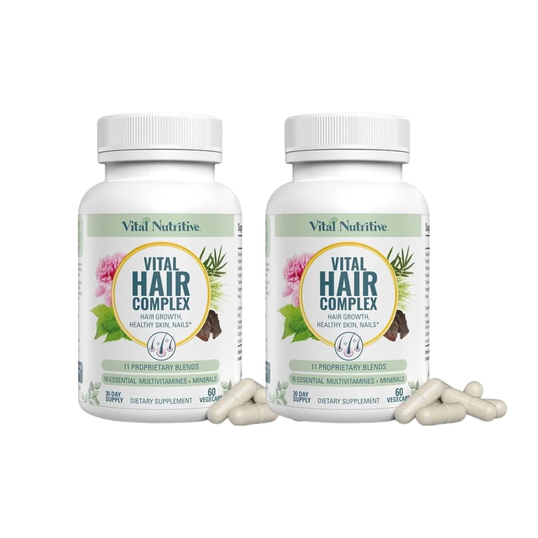 Two bottles of Vital Nutritive Hair Complex with supplements on a white background