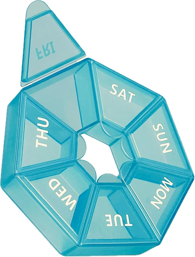 Blue geometric pill organizer with days of the week labels on a white background