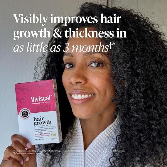 Woman holding a Viviscal hair growth supplement box with text about hair improvement.